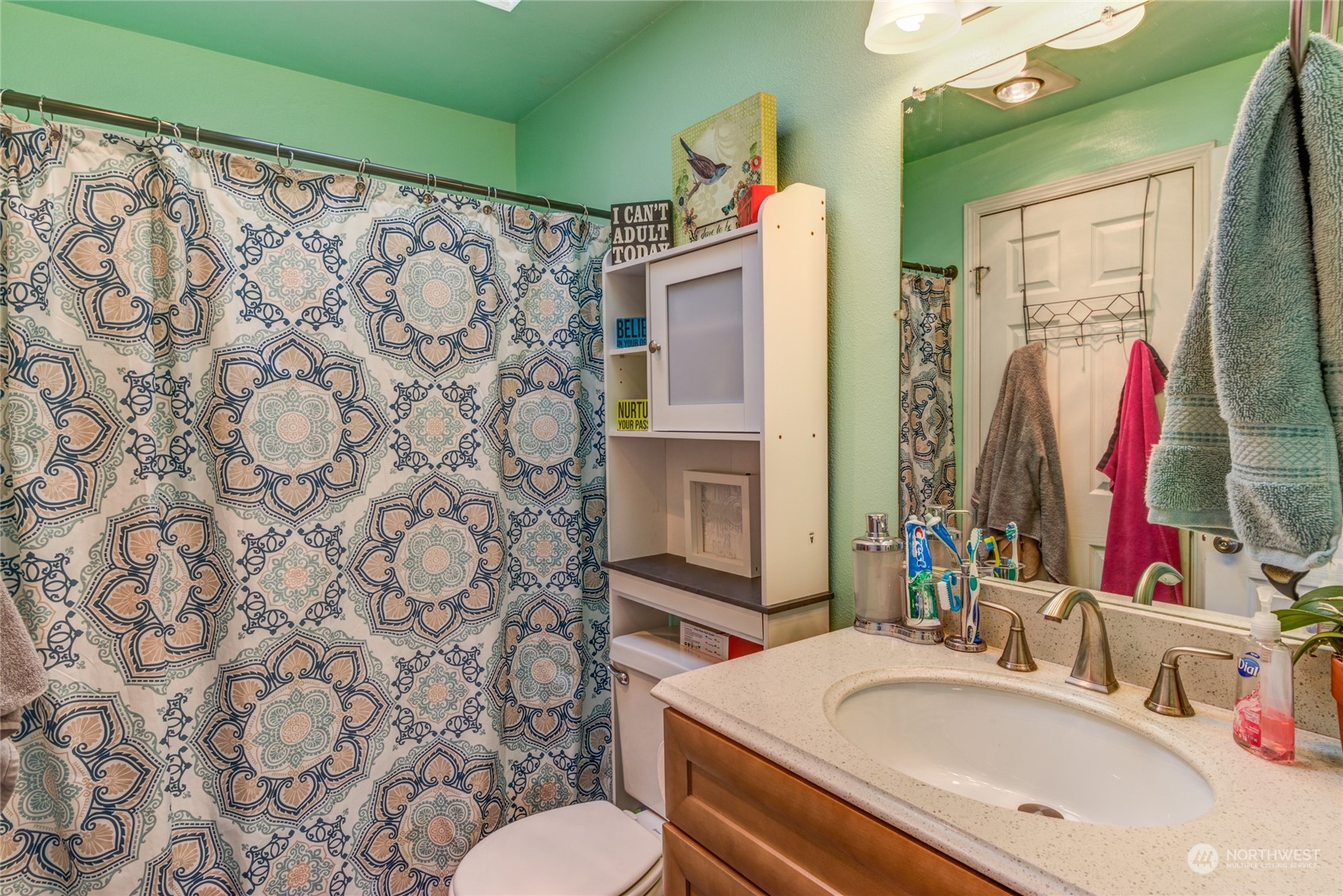 1663 South 48th Street Tacoma, WA 98408 - Photo 10 of 25 a bathroom with a sink toilet and shower