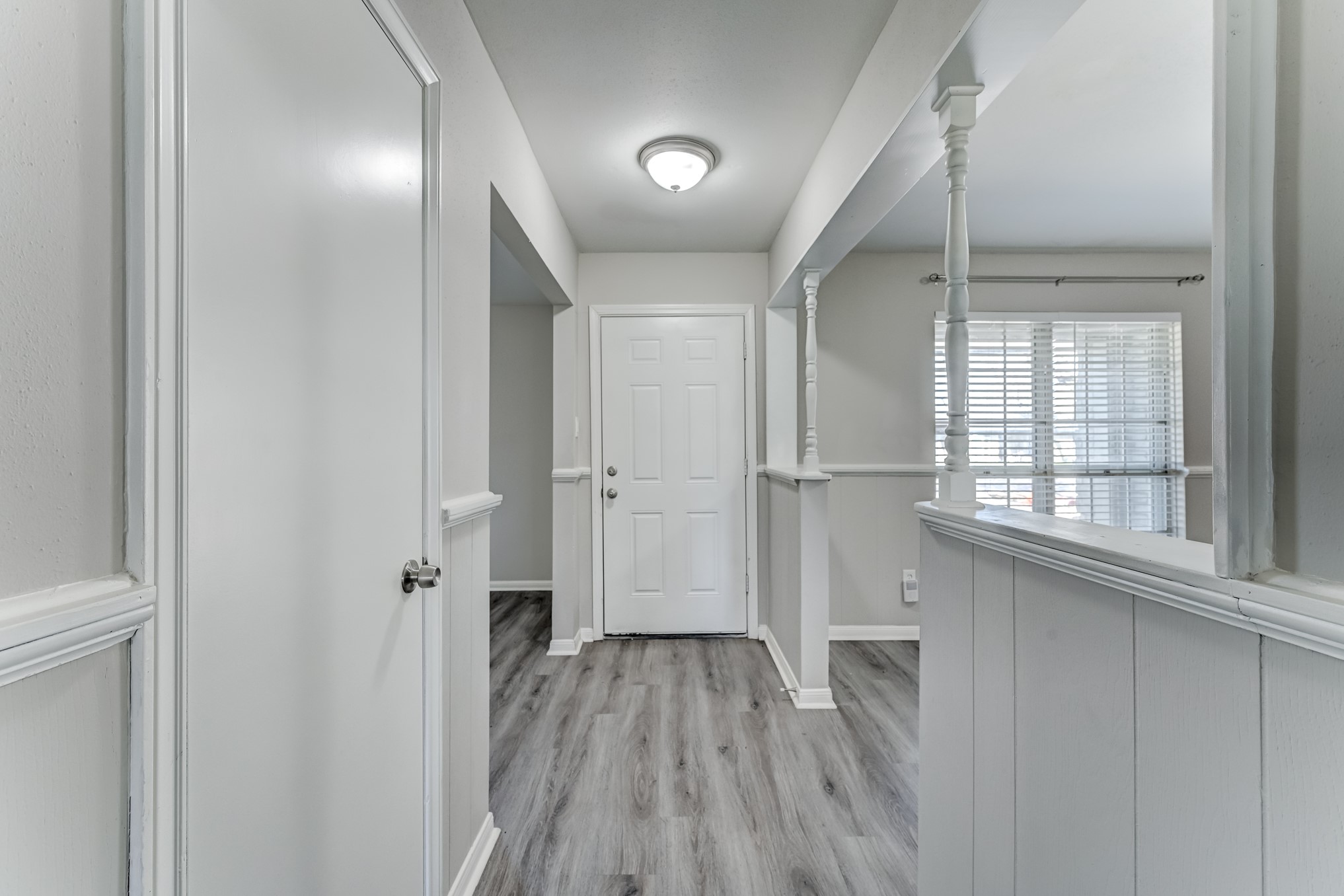 12415 Foxburo Drive Houston, TX 77065 - Photo 11 of 43 a view of a hallway with wooden floor and staircase