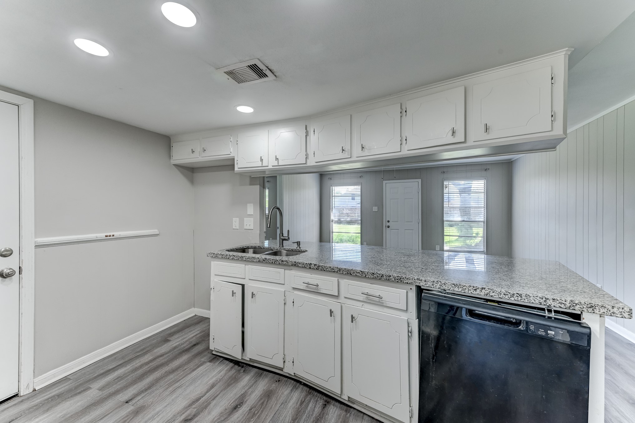 12415 Foxburo Drive Houston, TX 77065 - Photo 14 of 43 a kitchen with granite countertop stainless steel appliances a sink window and cabinets