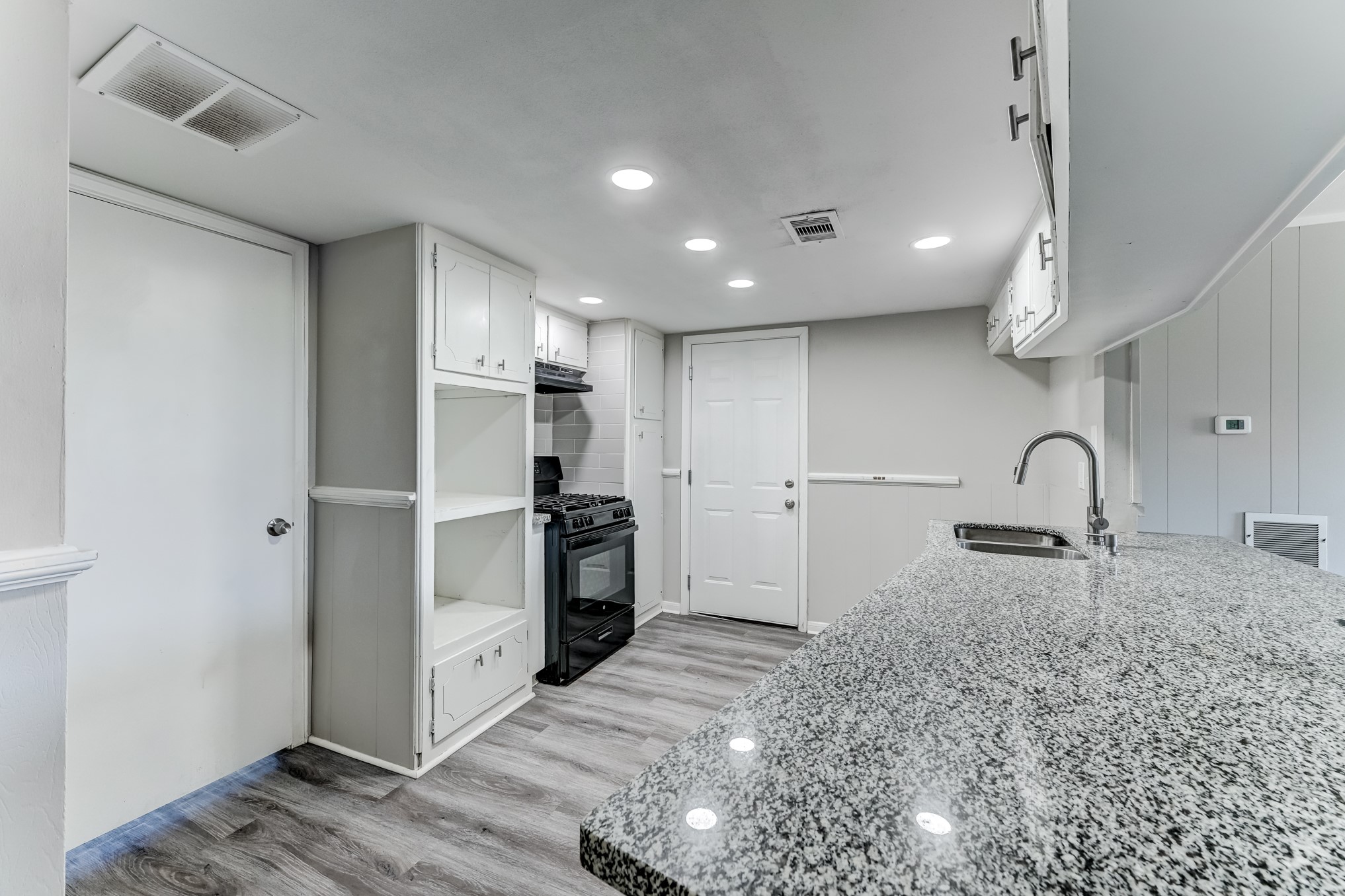 12415 Foxburo Drive Houston, TX 77065 - Photo 17 of 43 a kitchen with stainless steel appliances granite countertop a refrigerator and a sink