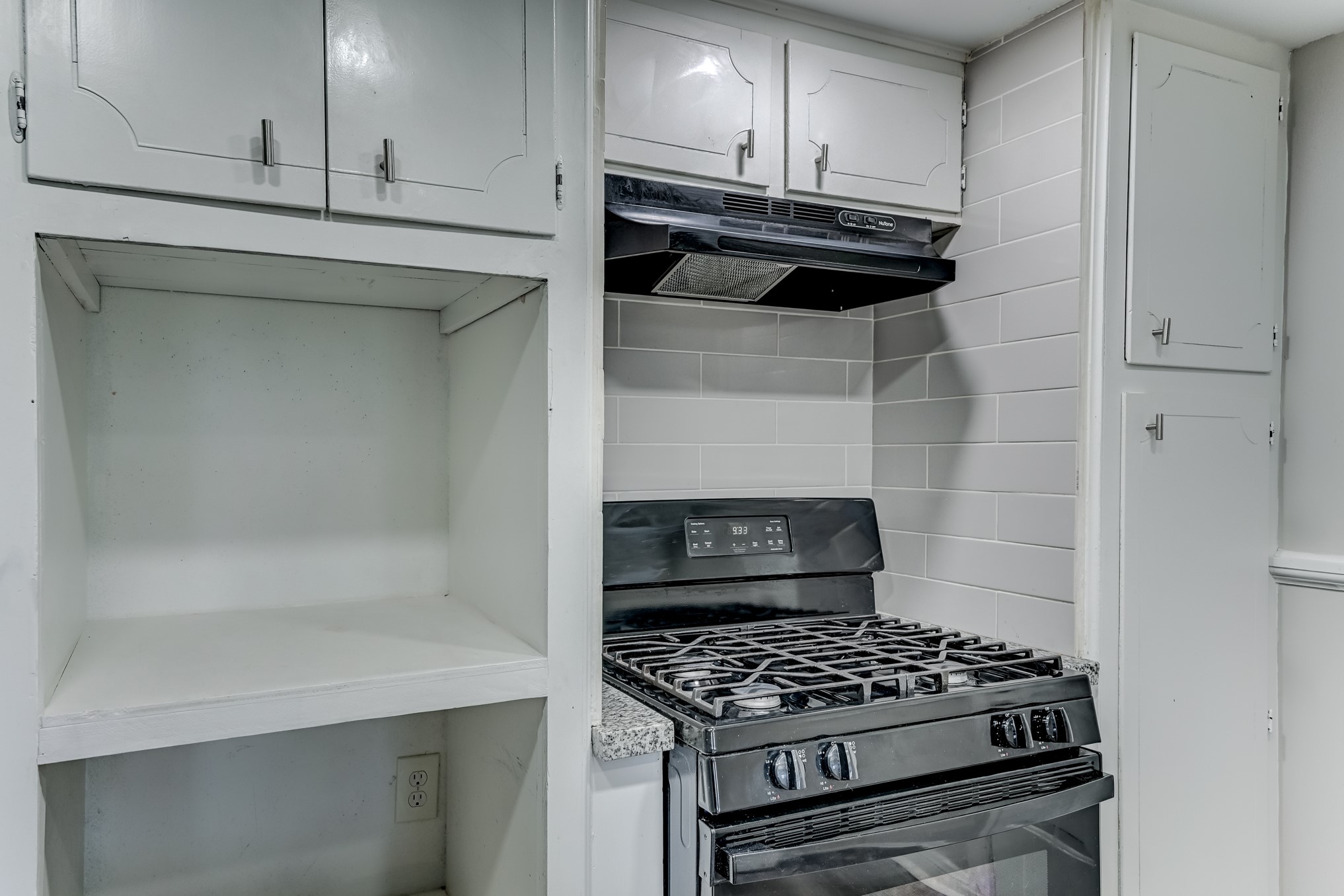 12415 Foxburo Drive Houston, TX 77065 - Photo 19 of 43 a kitchen with appliances cabinets and a stove top oven