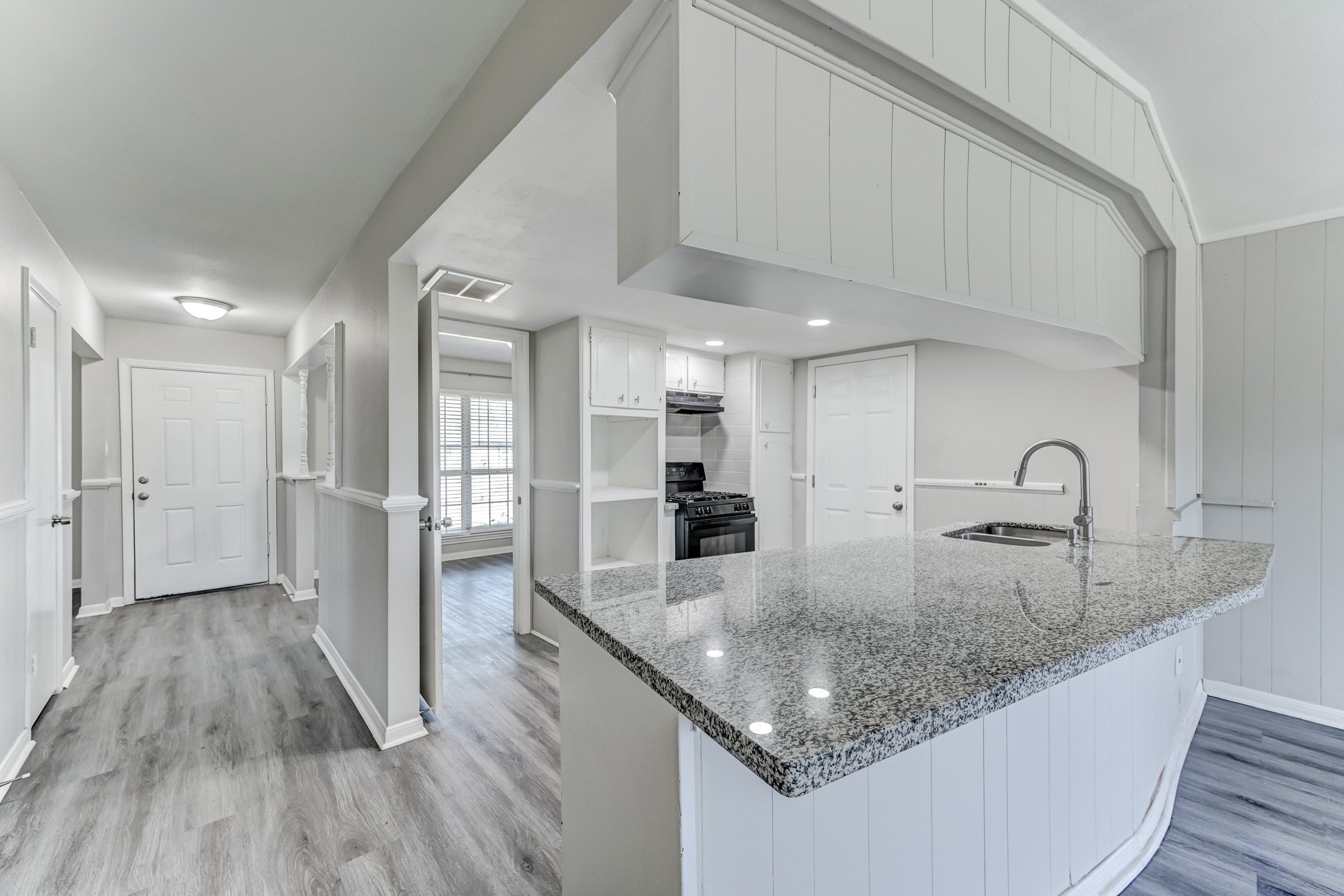12415 Foxburo Drive Houston, TX 77065 - Photo 20 of 43 a kitchen with stainless steel appliances granite countertop a lot of counter space and wooden floors