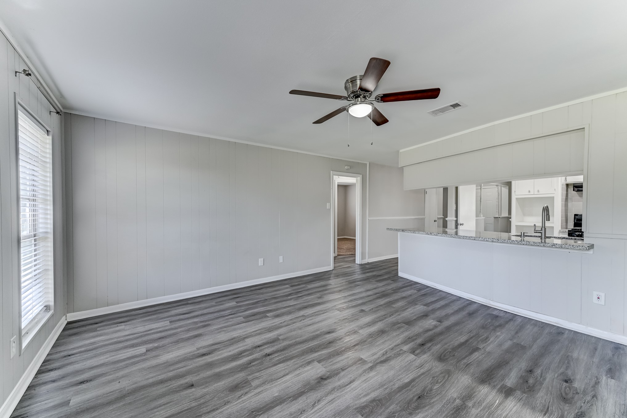 12415 Foxburo Drive Houston, TX 77065 - Photo 21 of 43 a view of empty room with wooden floor and window
