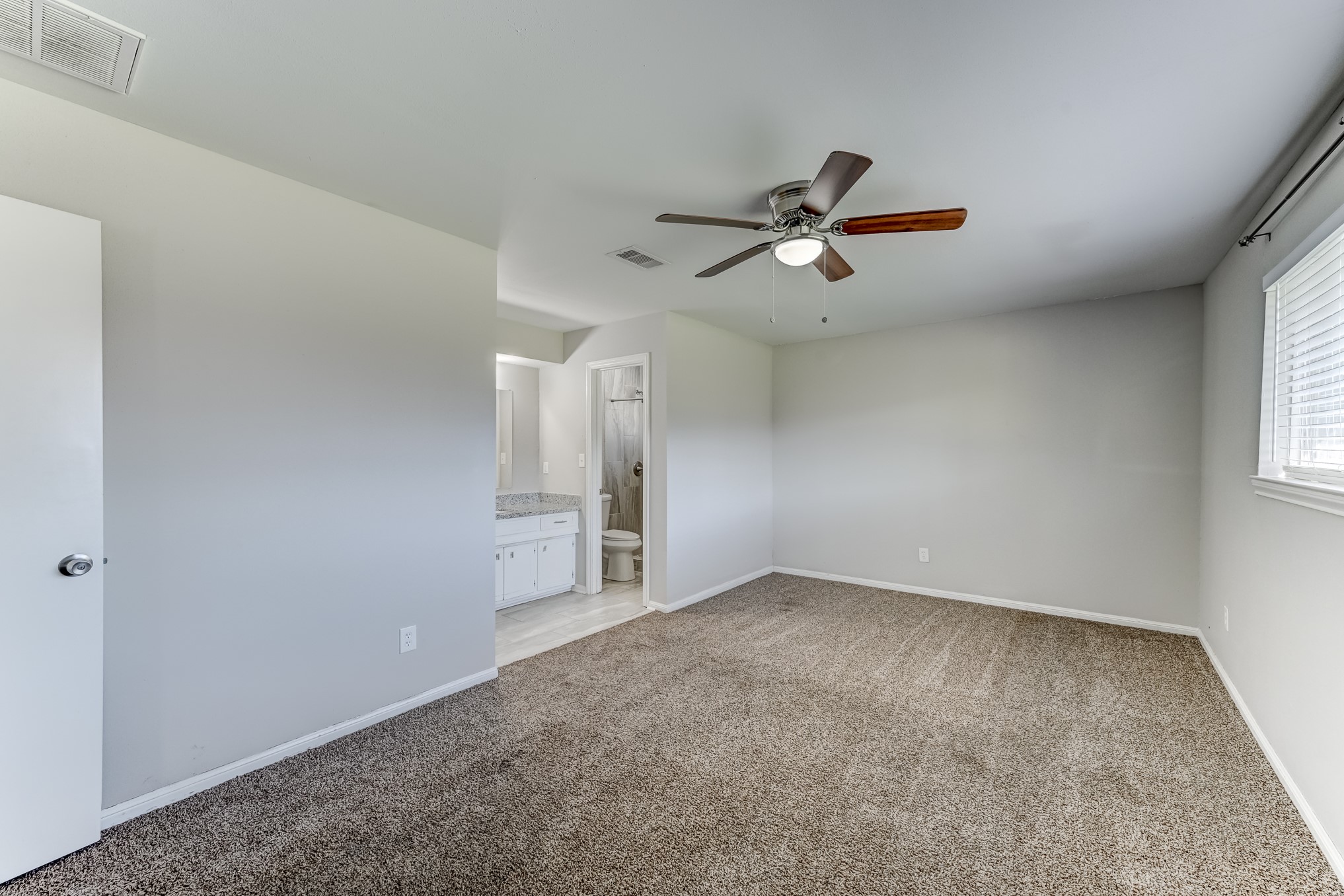 12415 Foxburo Drive Houston, TX 77065 - Photo 25 of 43 wooden floor in an empty room with a window