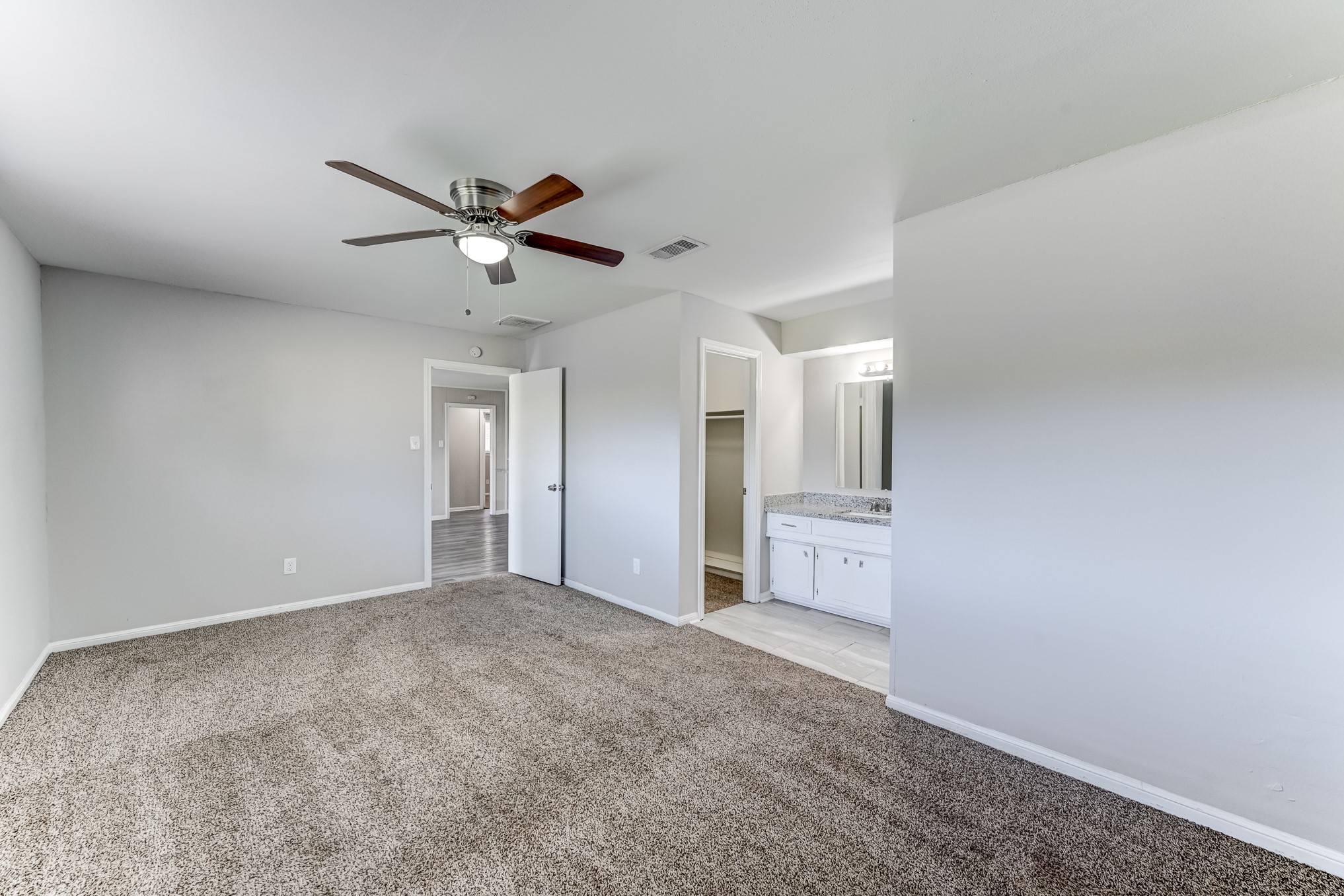 12415 Foxburo Drive Houston, TX 77065 - Photo 26 of 43 a view of an empty room and a ceiling fan