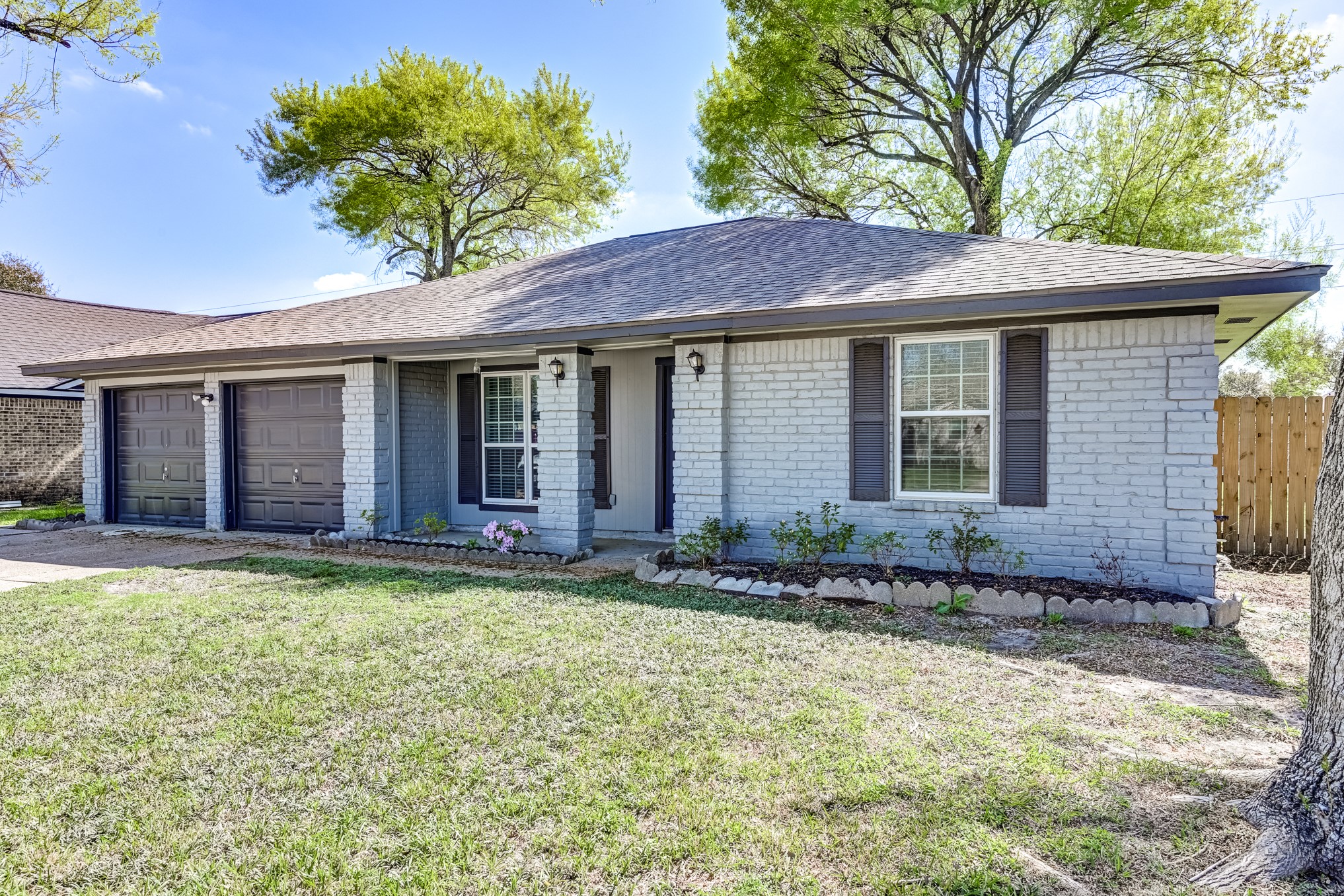 12415 Foxburo Drive Houston, TX 77065 - Photo 3 of 43 a front view of a house with a garden