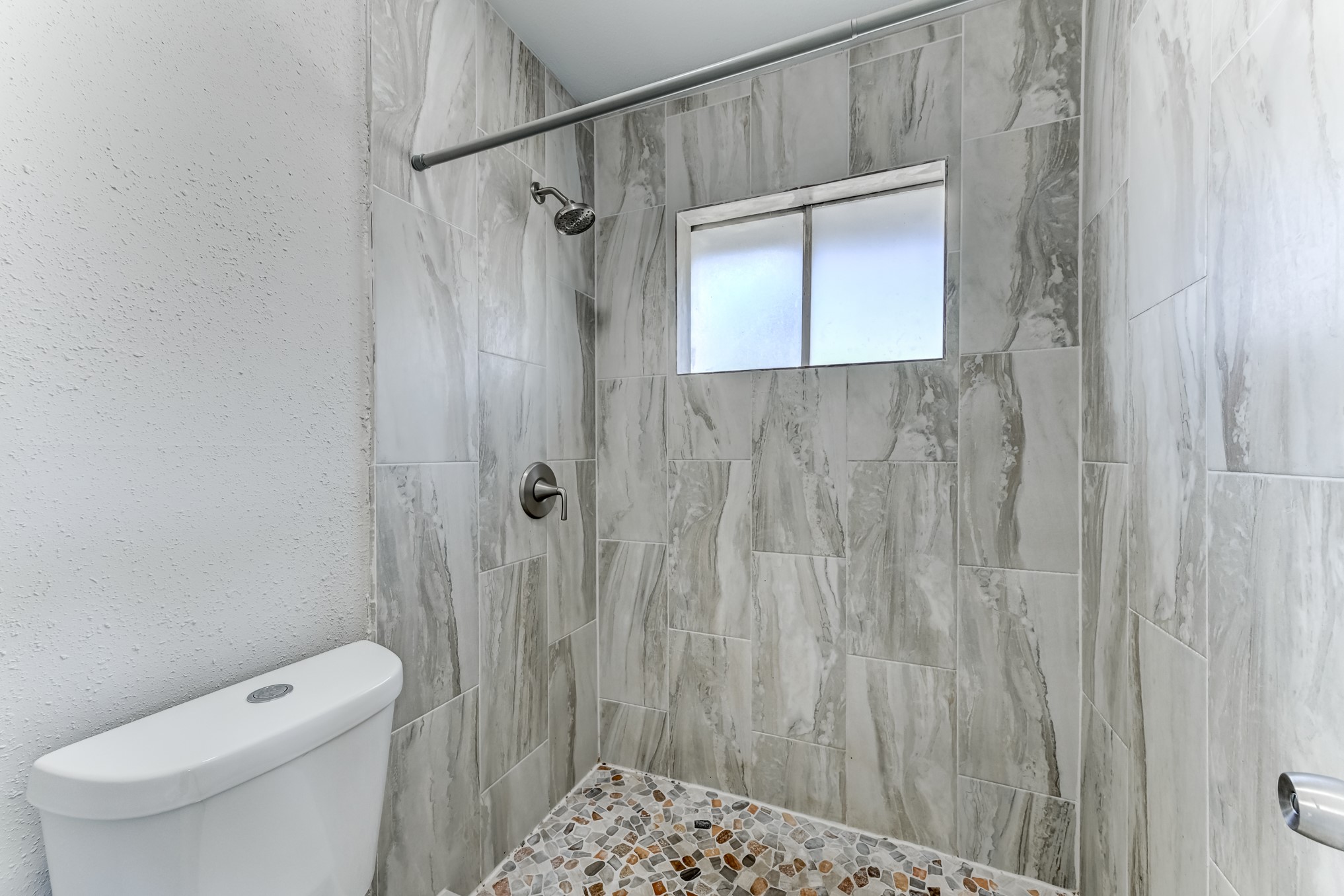 12415 Foxburo Drive Houston, TX 77065 - Photo 31 of 43 a bathroom with a shower toilet and sink