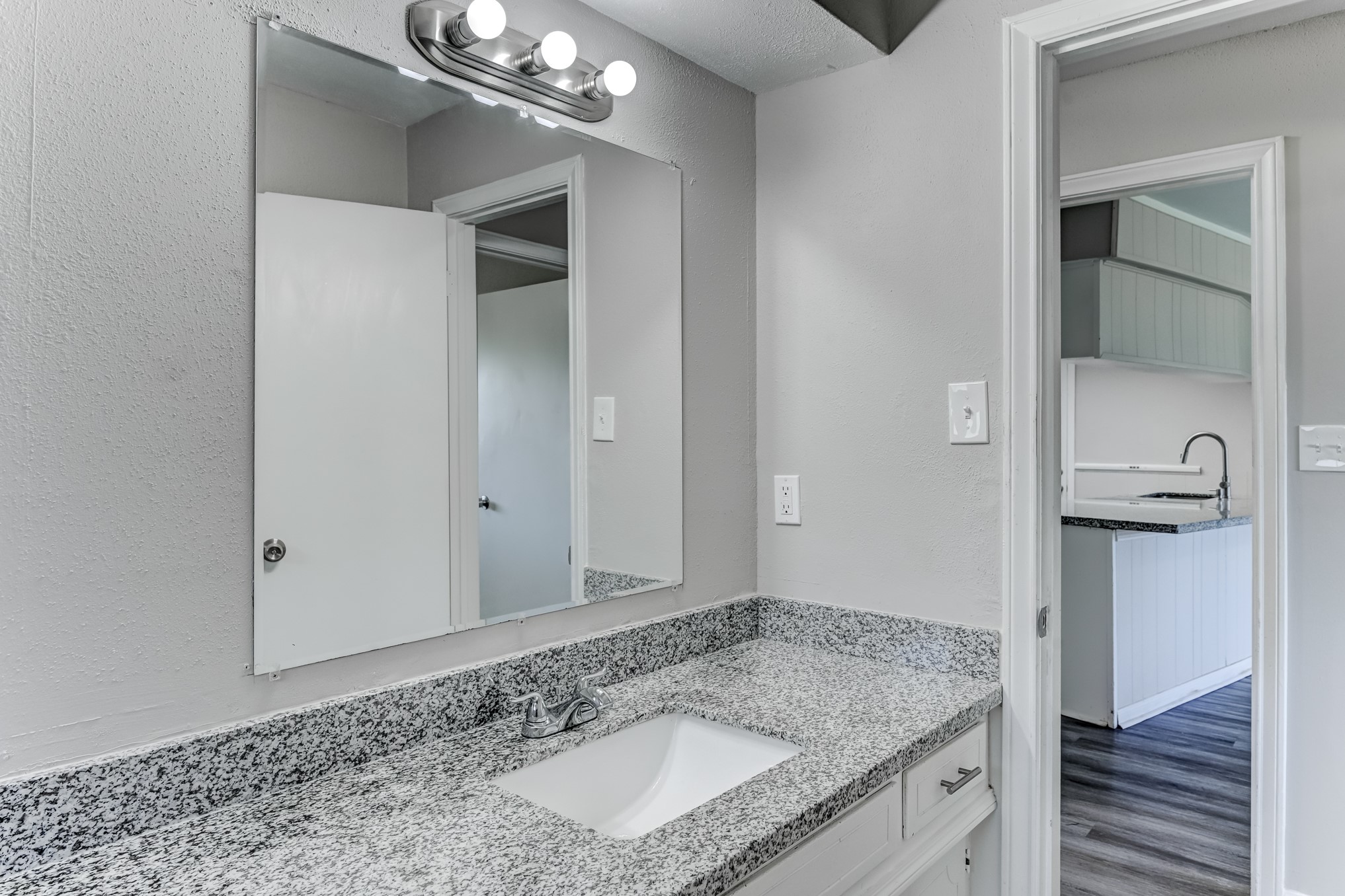 12415 Foxburo Drive Houston, TX 77065 - Photo 36 of 43 a bathroom with a granite countertop sink and a mirror