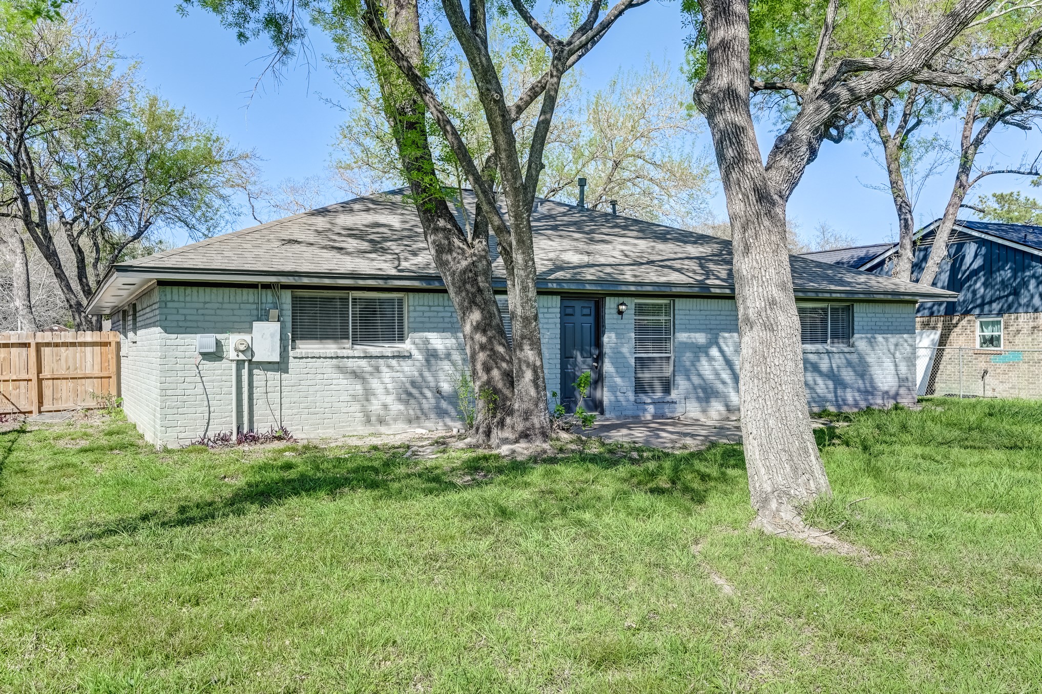12415 Foxburo Drive Houston, TX 77065 - Photo 41 of 43 a front view of a house with a yard and a large tree