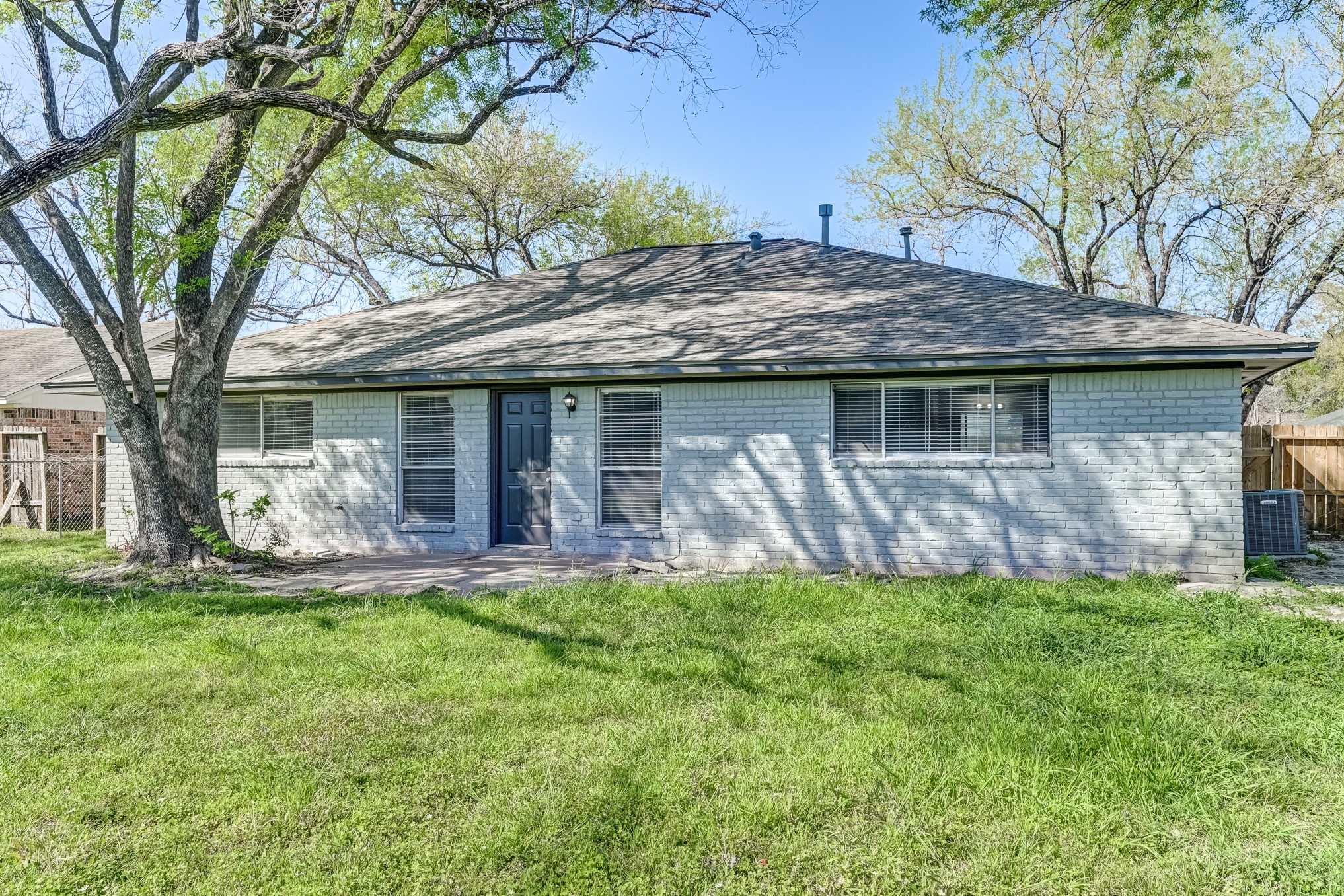12415 Foxburo Drive Houston, TX 77065 - Photo 42 of 43 a view of a house with a yard potted plants and large tree