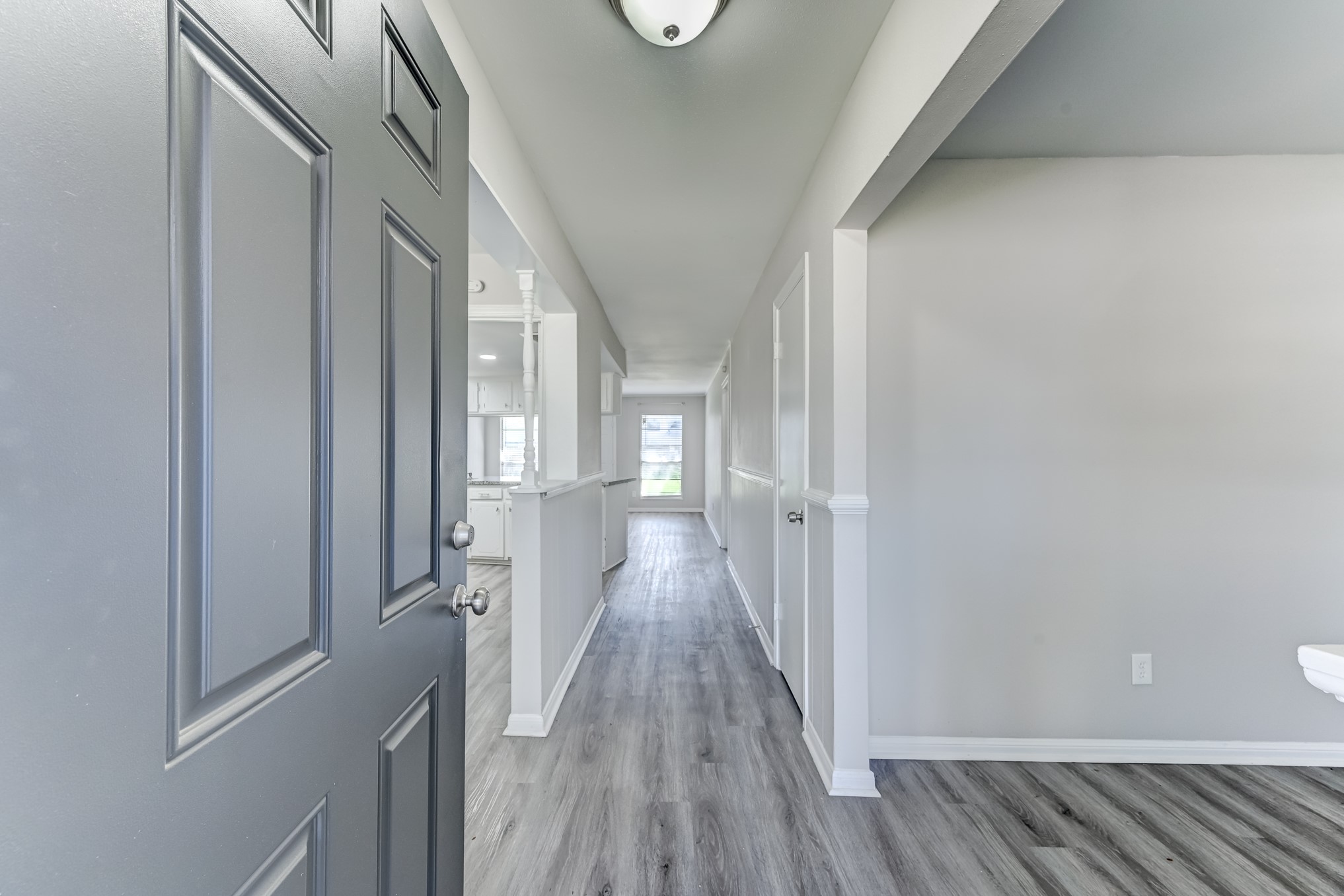 12415 Foxburo Drive Houston, TX 77065 - Photo 5 of 43 a view of a hallway with wooden floor and staircase