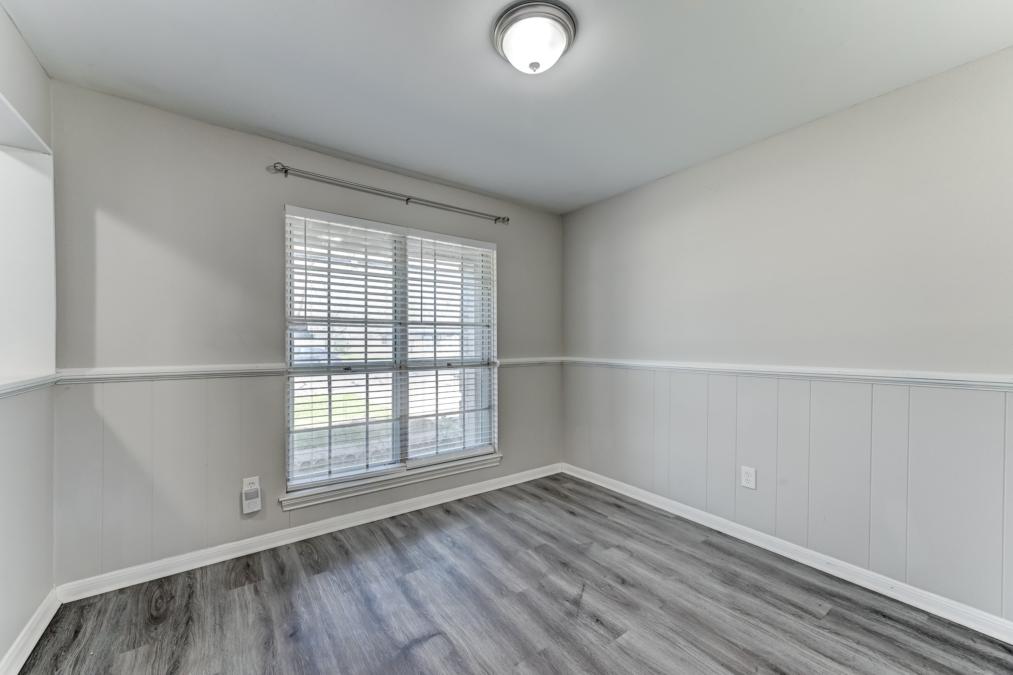 12415 Foxburo Drive Houston, TX 77065 - Photo 8 of 43 an empty room with wooden floor and windows