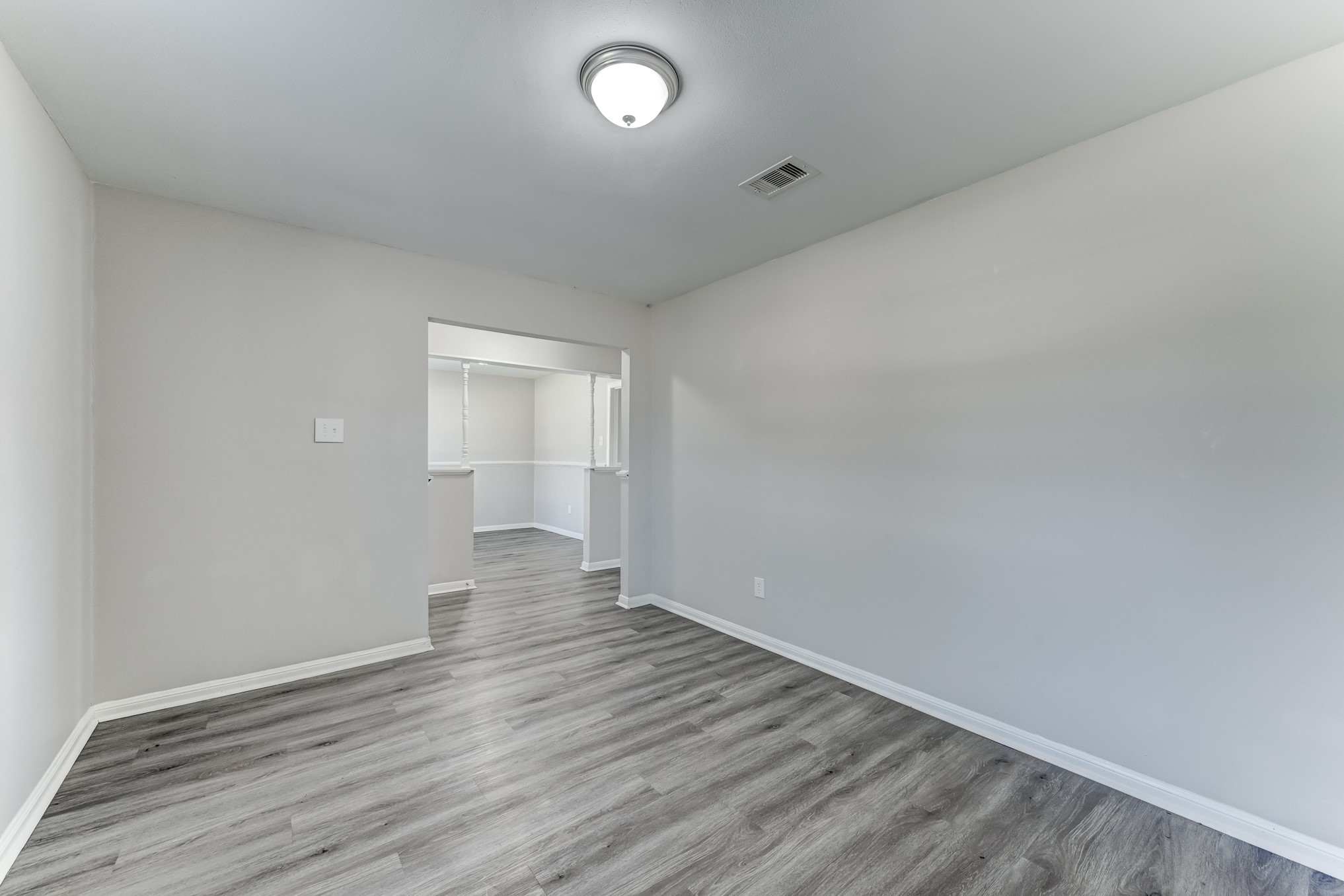 12415 Foxburo Drive Houston, TX 77065 - Photo 10 of 43 wooden floor in a hall with an empty room