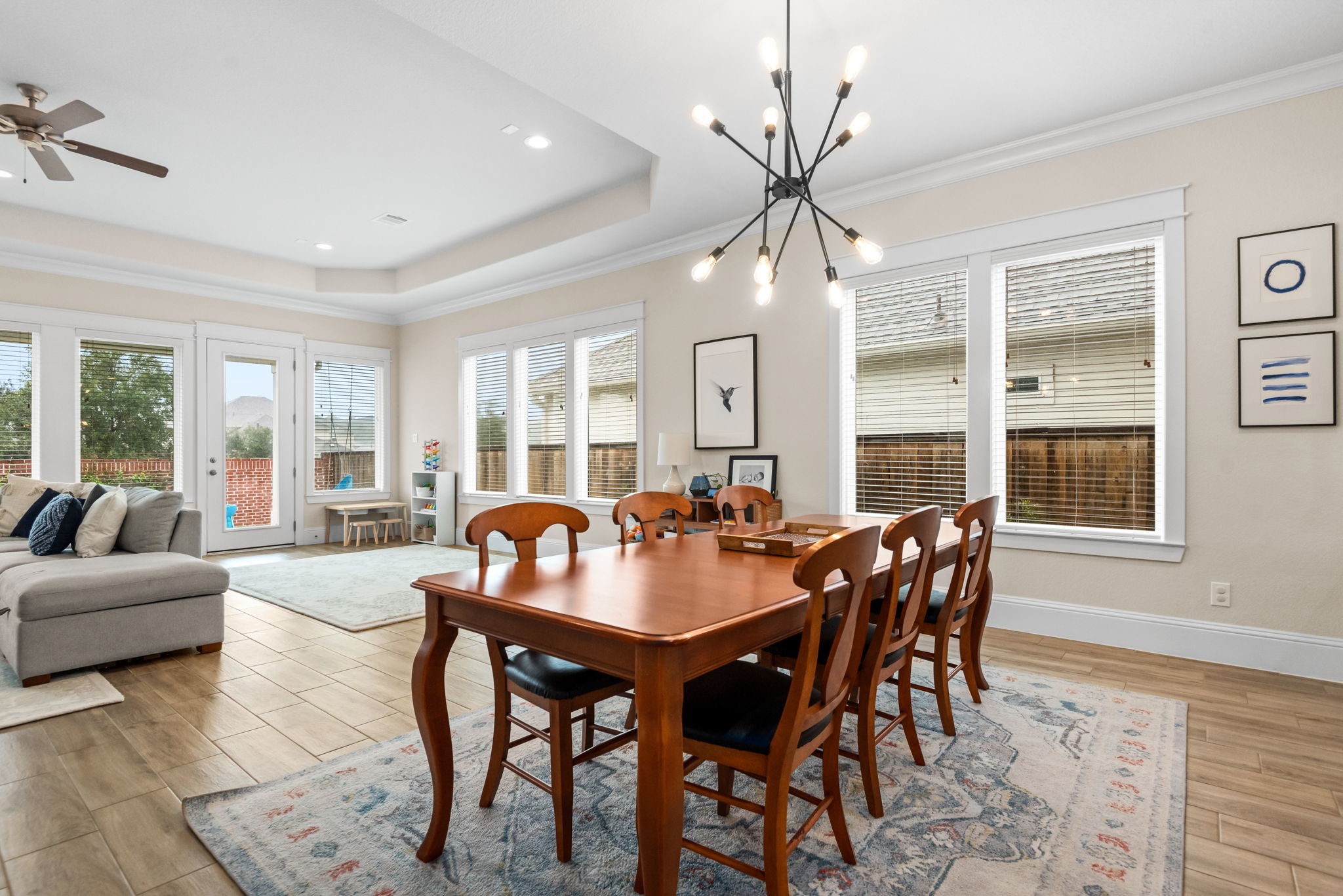 2335 Pale Star Drive Conroe, TX 77384 - Photo 12 of 42 a dining room with furniture a chandelier and wooden floor