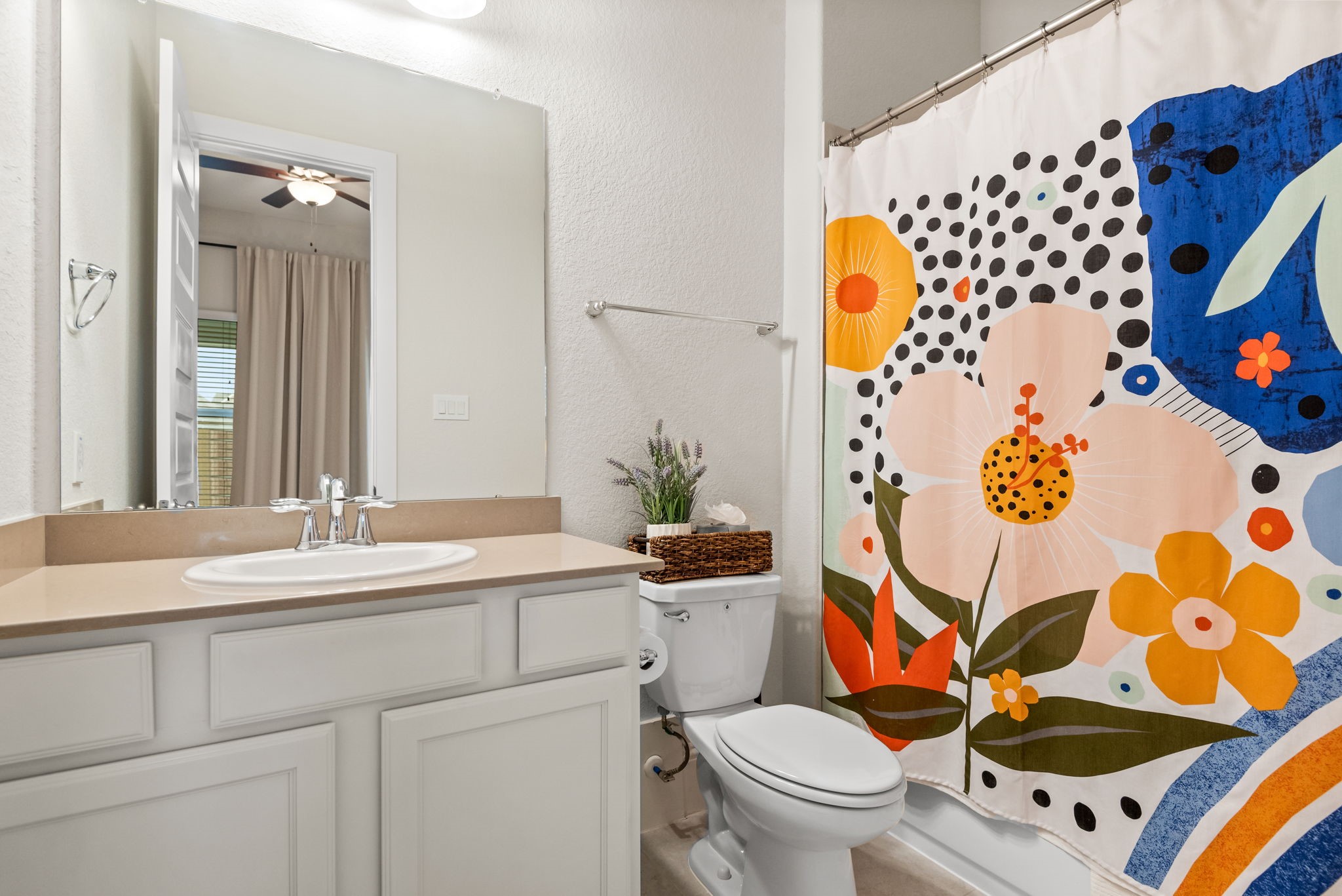 2335 Pale Star Drive Conroe, TX 77384 - Photo 27 of 42 a bathroom with a sink mirror vanity and toilet