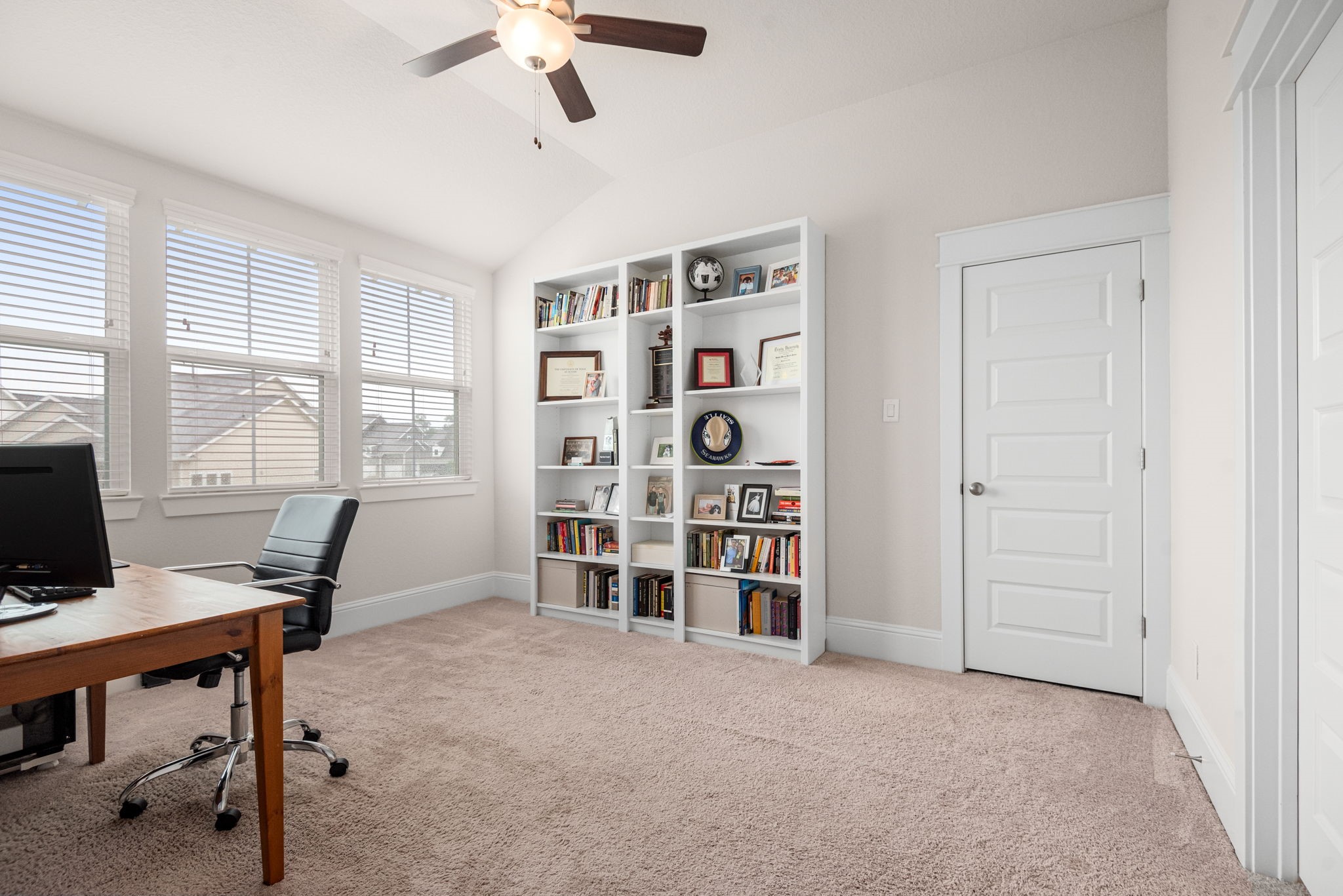 2335 Pale Star Drive Conroe, TX 77384 - Photo 33 of 42 a view of a workspace with furniture and a window