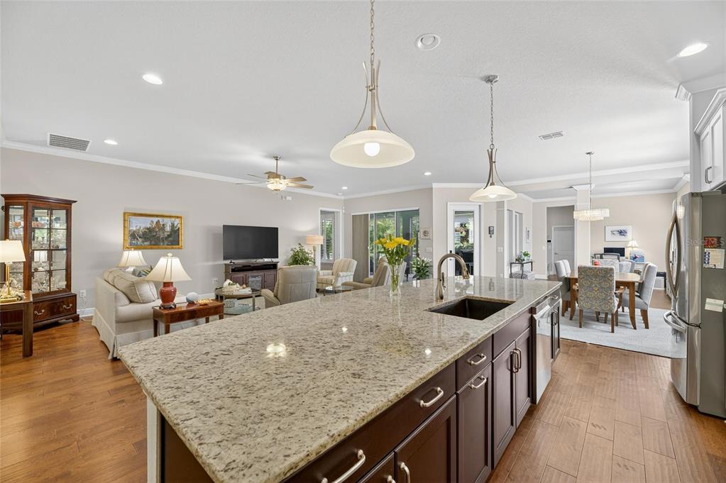 6002 Sparrowhead Way Lithia, FL 33547 - Photo 15 of 55 a kitchen with stainless steel appliances granite countertop a sink and a refrigerator