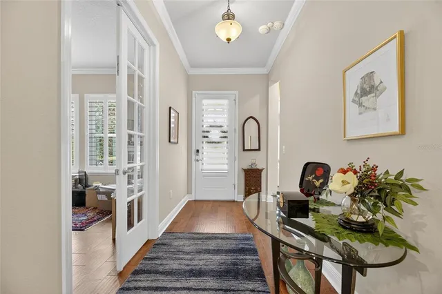 a kitchen with stainless steel appliances a stove microwave and cabinets