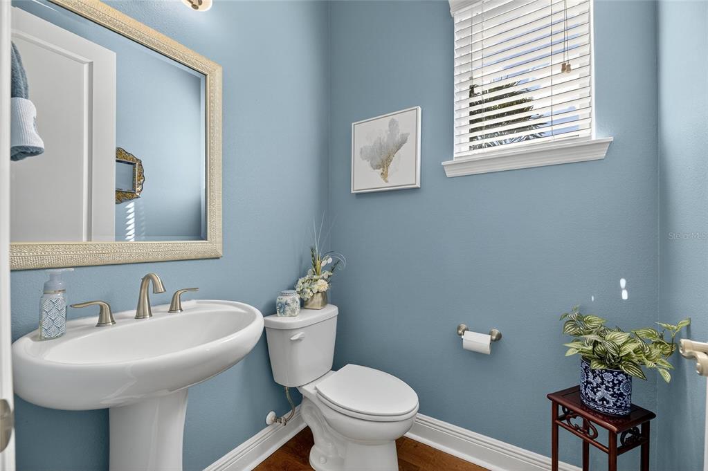 6002 Sparrowhead Way Lithia, FL 33547 - Photo 27 of 55 a bathroom with a sink mirror and toilet