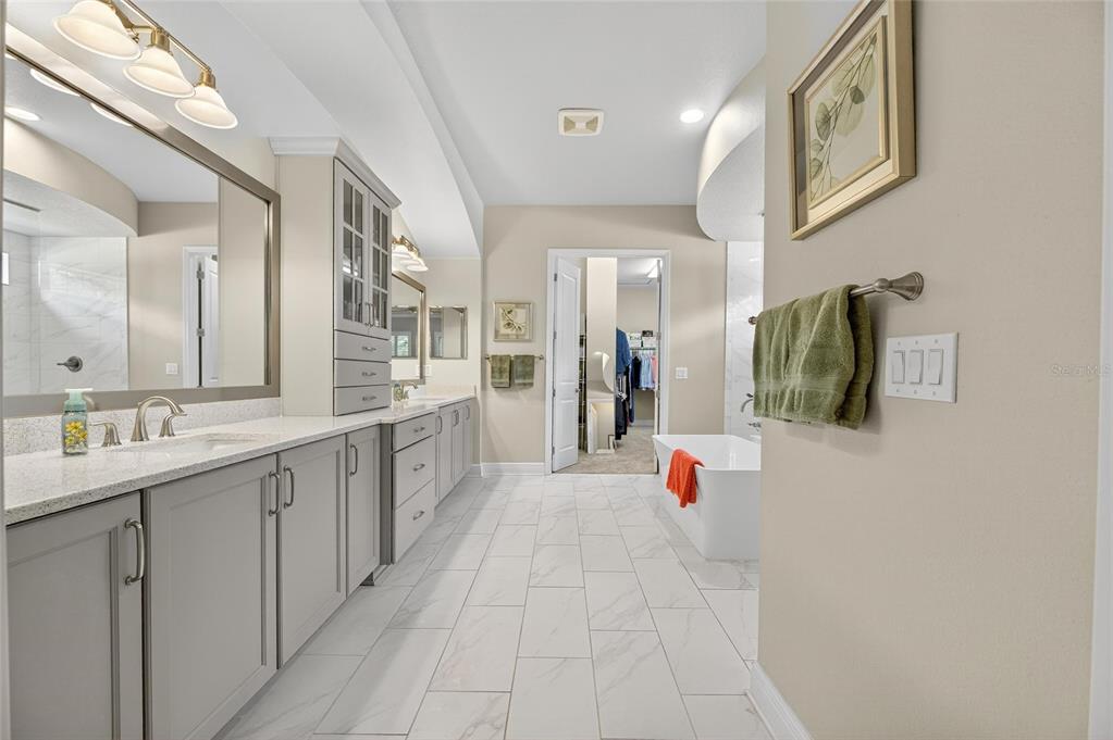 6002 Sparrowhead Way Lithia, FL 33547 - Photo 30 of 55 a bathroom with a sink and mirror