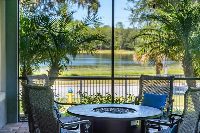 a view of a chairs and table in patio