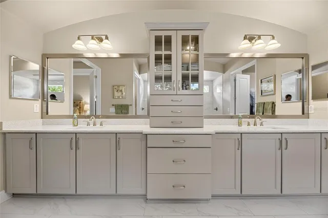 a bath room with a bath tub and a shower