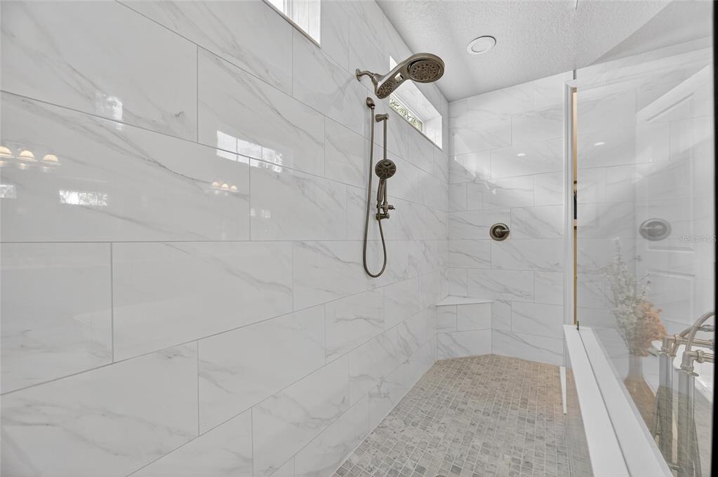 6002 Sparrowhead Way Lithia, FL 33547 - Photo 34 of 57 a bathroom with a shower