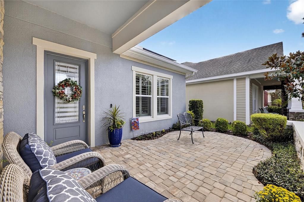 6002 Sparrowhead Way Lithia, FL 33547 - Photo 4 of 55 a man sitting on a bed in front of a house