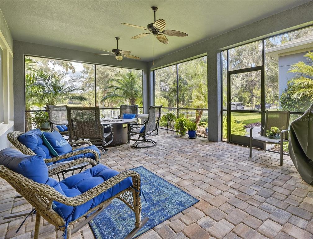 6002 Sparrowhead Way Lithia, FL 33547 - Photo 41 of 57 a living room with furniture and a floor to ceiling window