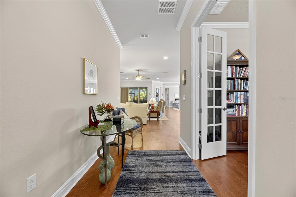 6002 Sparrowhead Way Lithia, FL 33547 - Photo 7 of 55 a view of a hallway with wooden floor and staircase