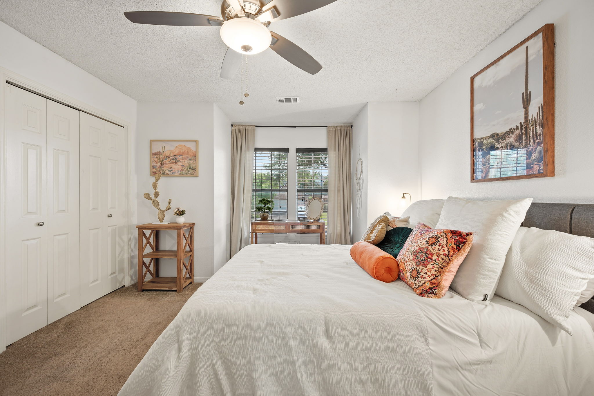 705 Canyon Bend Road Pflugerville, TX 78660 - Photo 17 of 23 a bedroom with a large bed and a chandelier