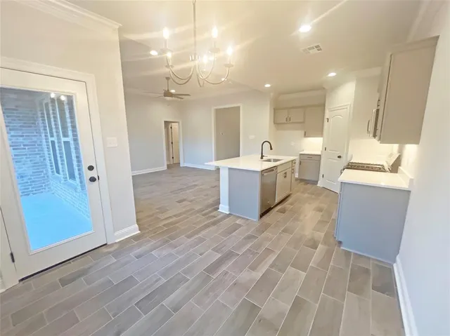 a view of kitchen with sink and cabinet