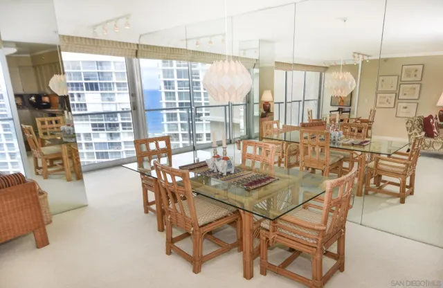 a view of a dining room with furniture and a window