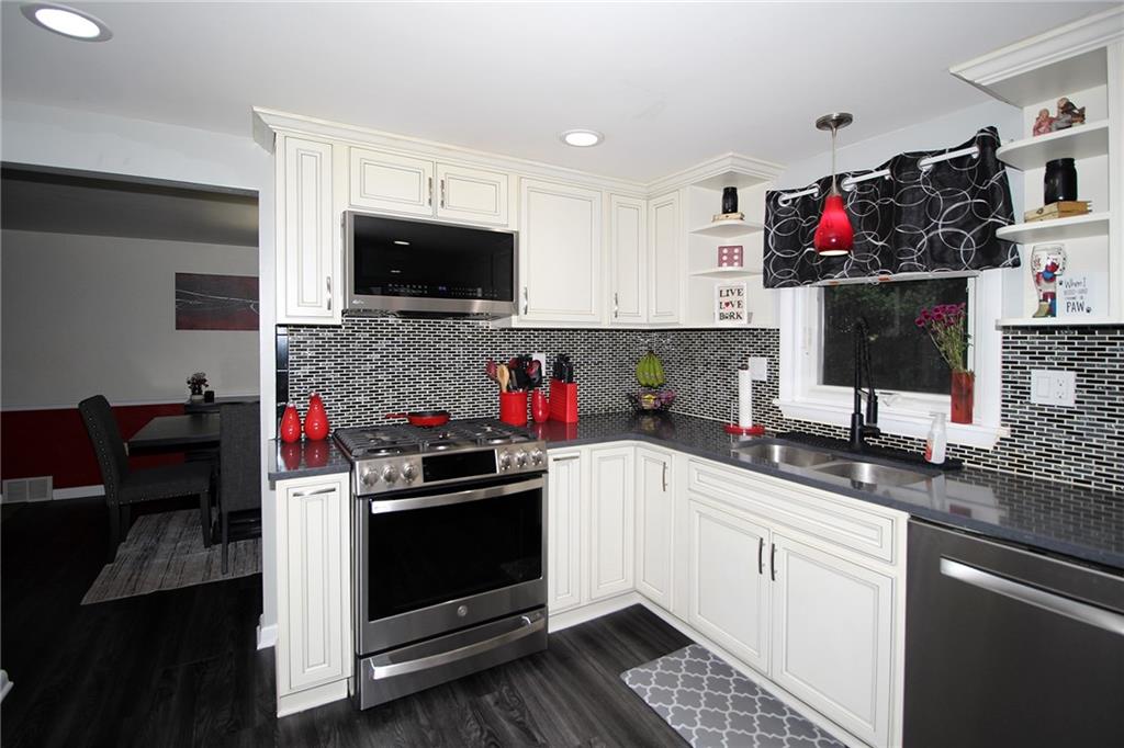 21 Meadowcrest Drive Cecil, PA 15321 - Photo 33 of 36 a kitchen that has a sink and a stove top oven