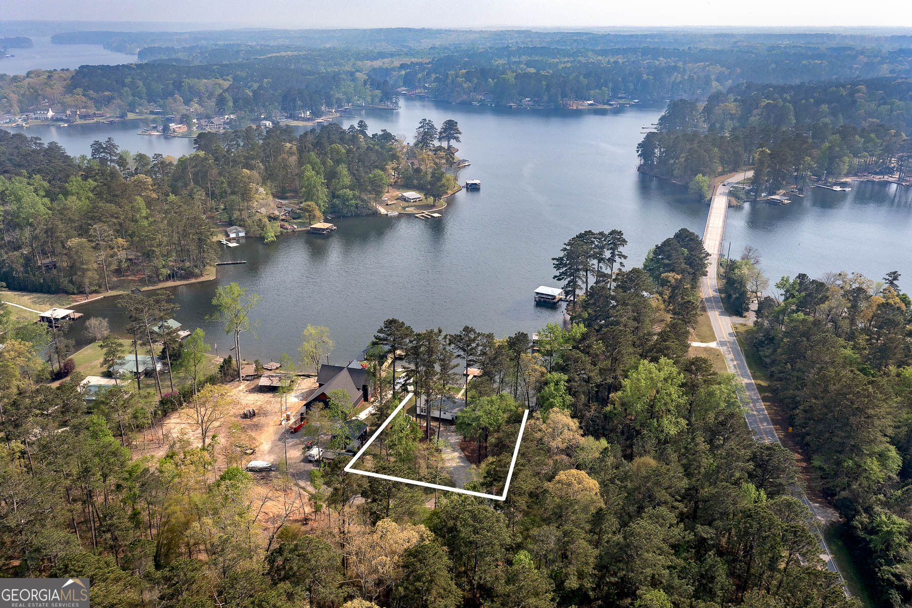 595 Barnetts Bridge Road Jackson, GA 30233 - Photo 5 of 47 an aerial view of a house with a lake view