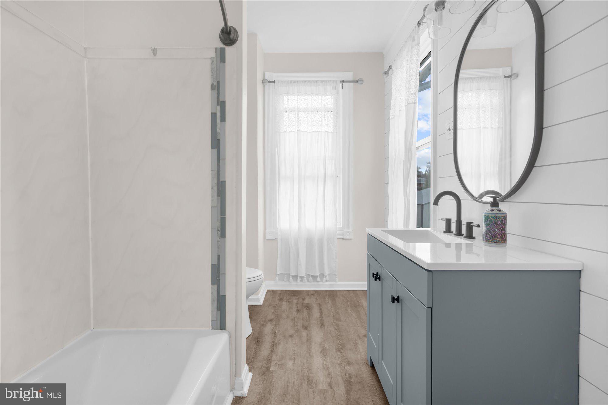 109 New Holland Avenue Reading, PA 19607 - Photo 17 of 36 a bathroom with a sink and a mirror