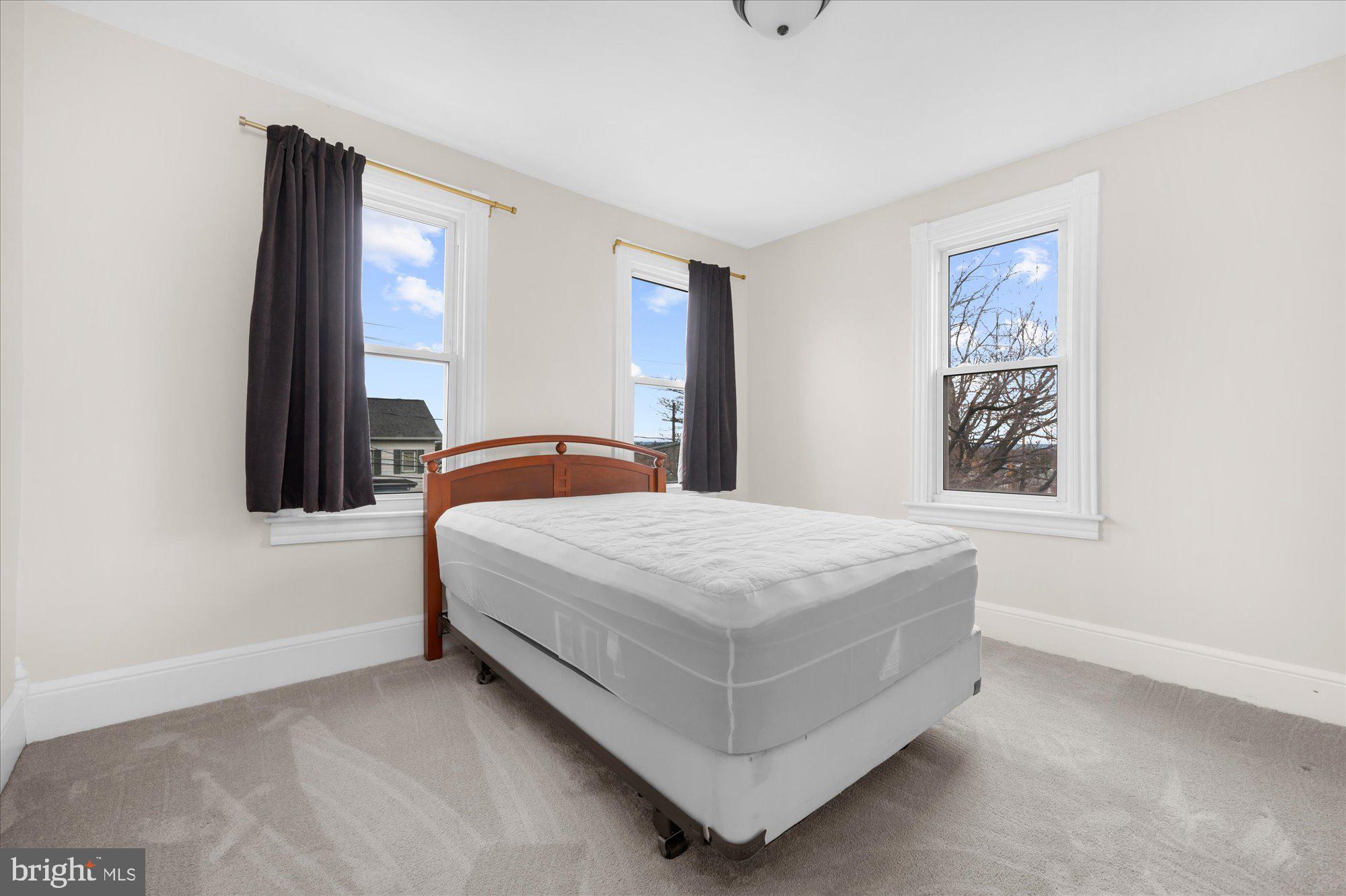 109 New Holland Avenue Reading, PA 19607 - Photo 25 of 36 a bedroom with a bed and window