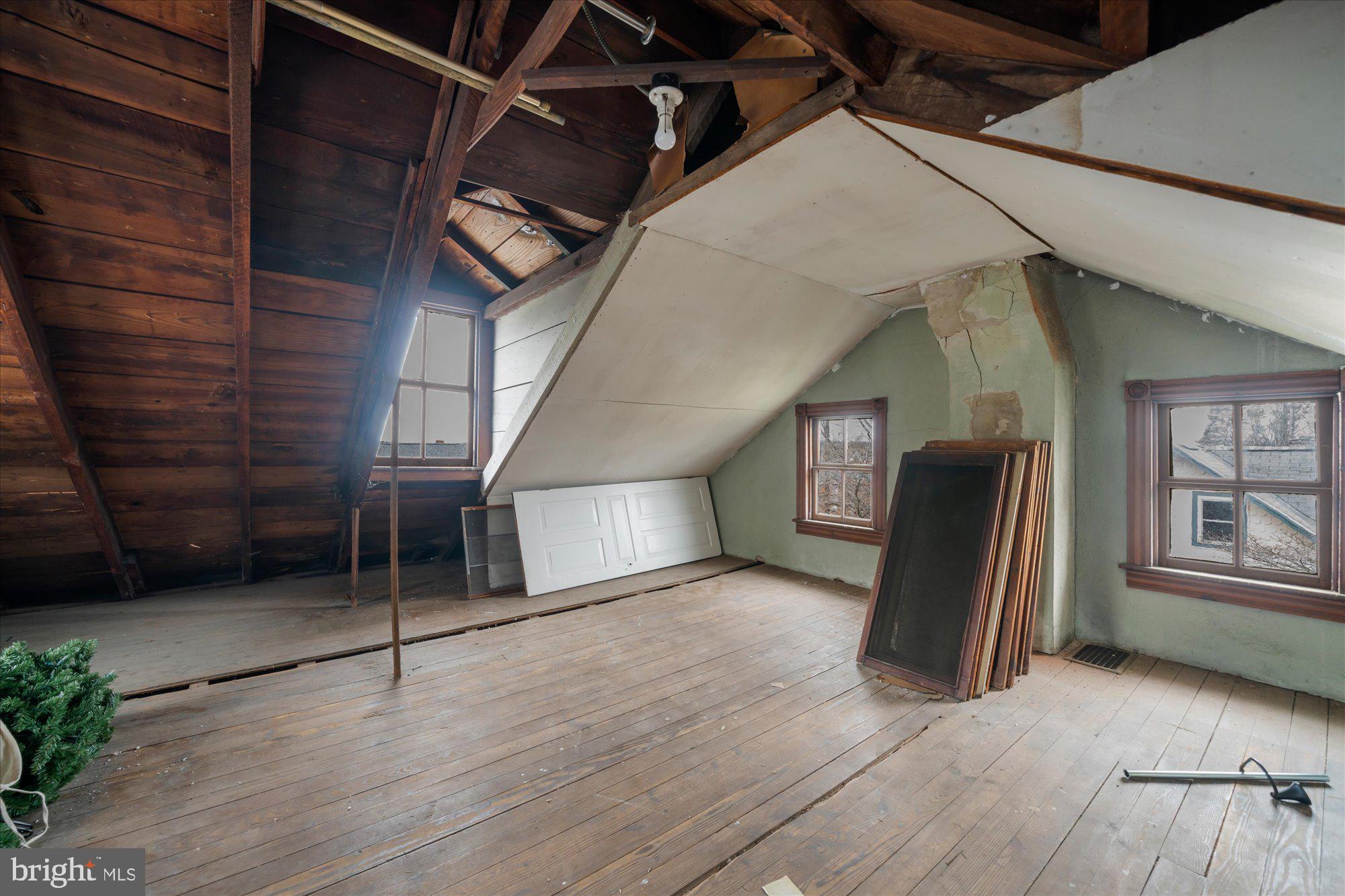 109 New Holland Avenue Reading, PA 19607 - Photo 26 of 36 a view of an empty room with wooden floor and a window