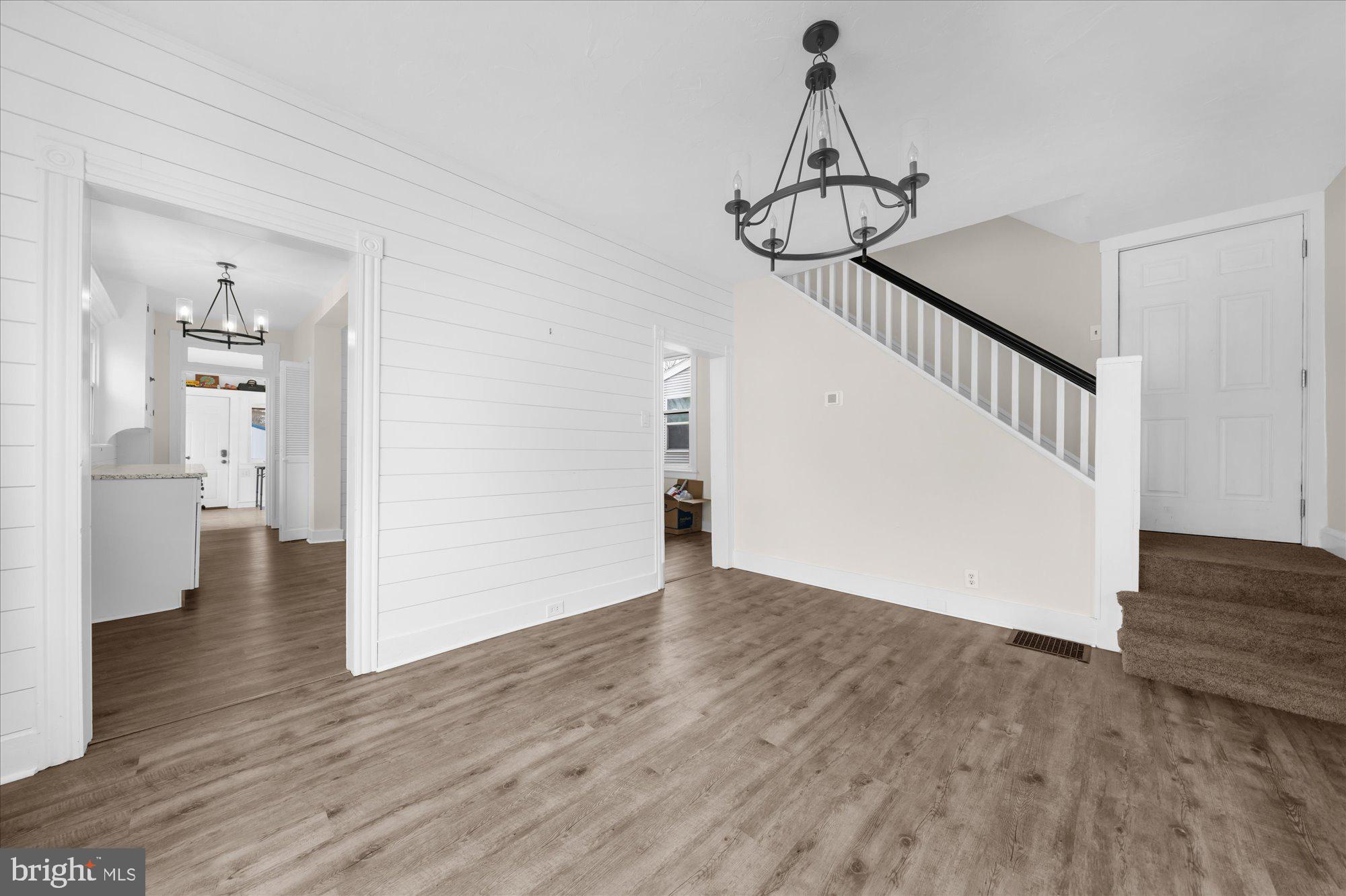 109 New Holland Avenue Reading, PA 19607 - Photo 8 of 36 a view of a room with wooden floor and staircase