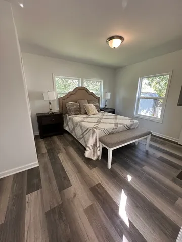 a bedroom with a bed and window