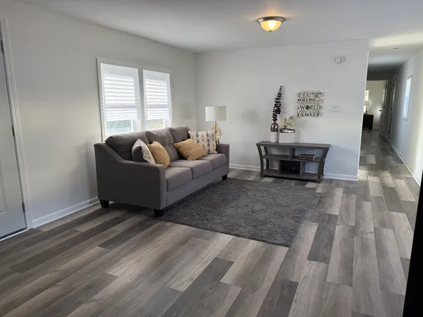 a living room with furniture and window