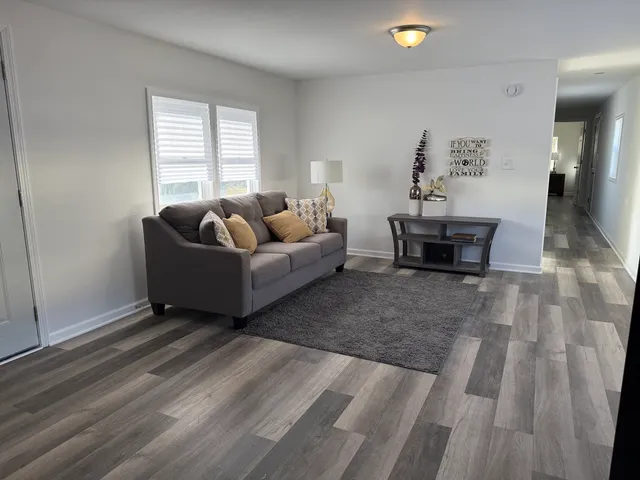 a living room with furniture and window