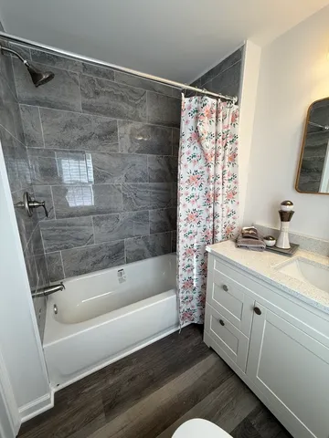 a bathroom with a bathtub and a shower