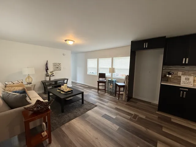 a living room with furniture and a table