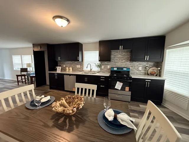 a kitchen with a table and chairs