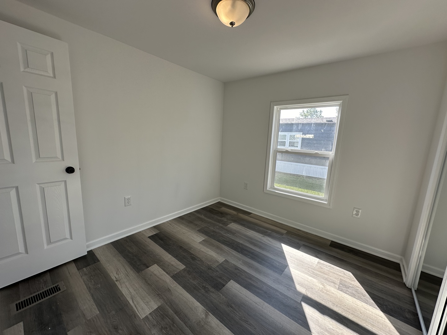241 Blackthorn Road Matteson, IL 60443 - Photo 4 of 41 a view of an empty room and window