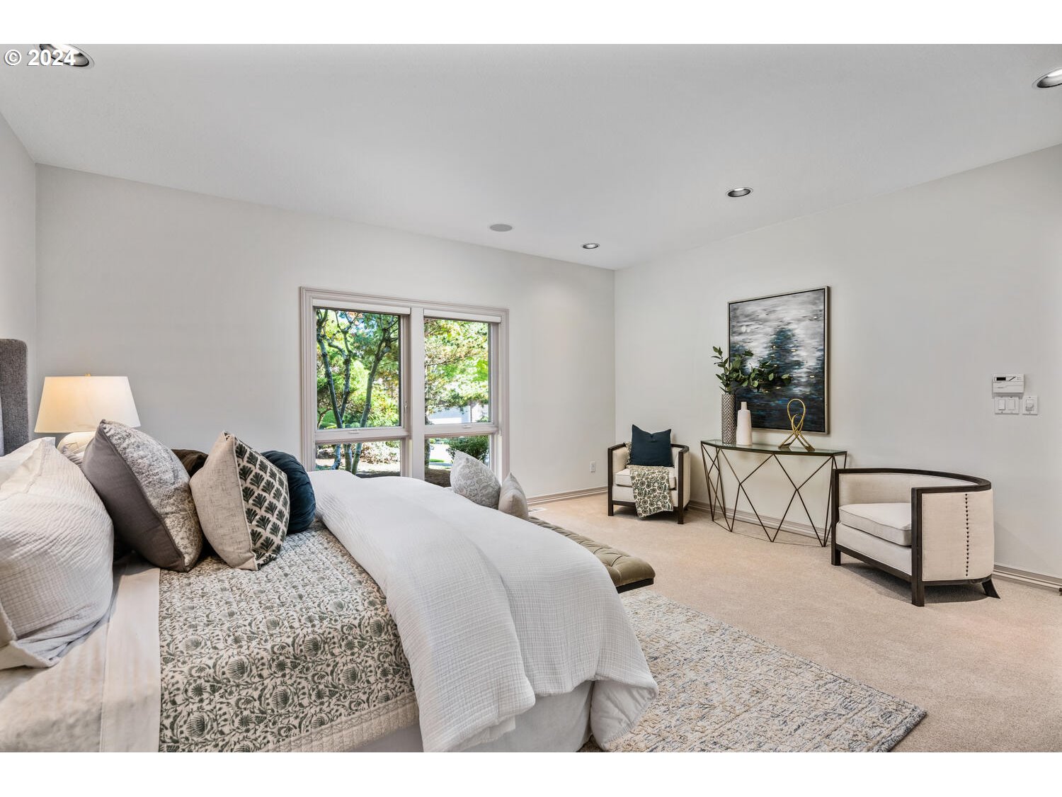 4083 Southeast Augusta Loop Gresham, OR 97080 - Photo 26 of 48 a bedroom with a bed a couch and dresser