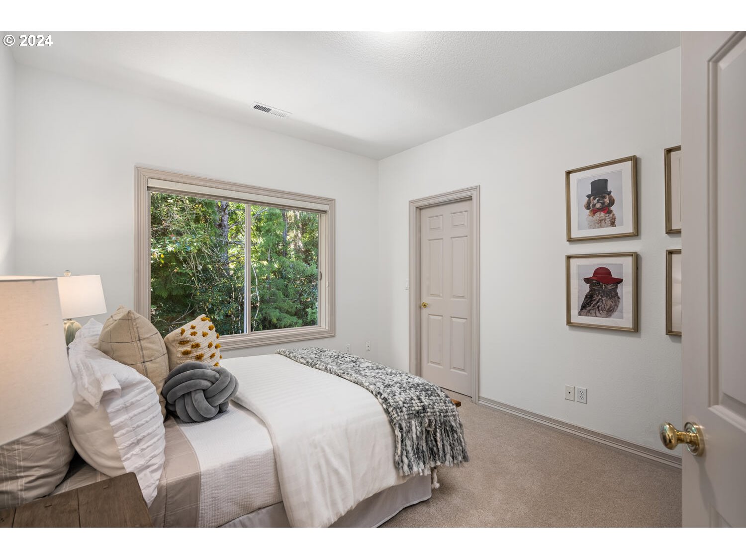 4083 Southeast Augusta Loop Gresham, OR 97080 - Photo 36 of 48 a bedroom with a bed and a large window
