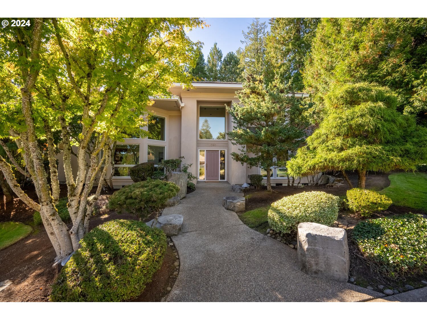 4083 Southeast Augusta Loop Gresham, OR 97080 - Photo 4 of 48 a front view of a house with a yard