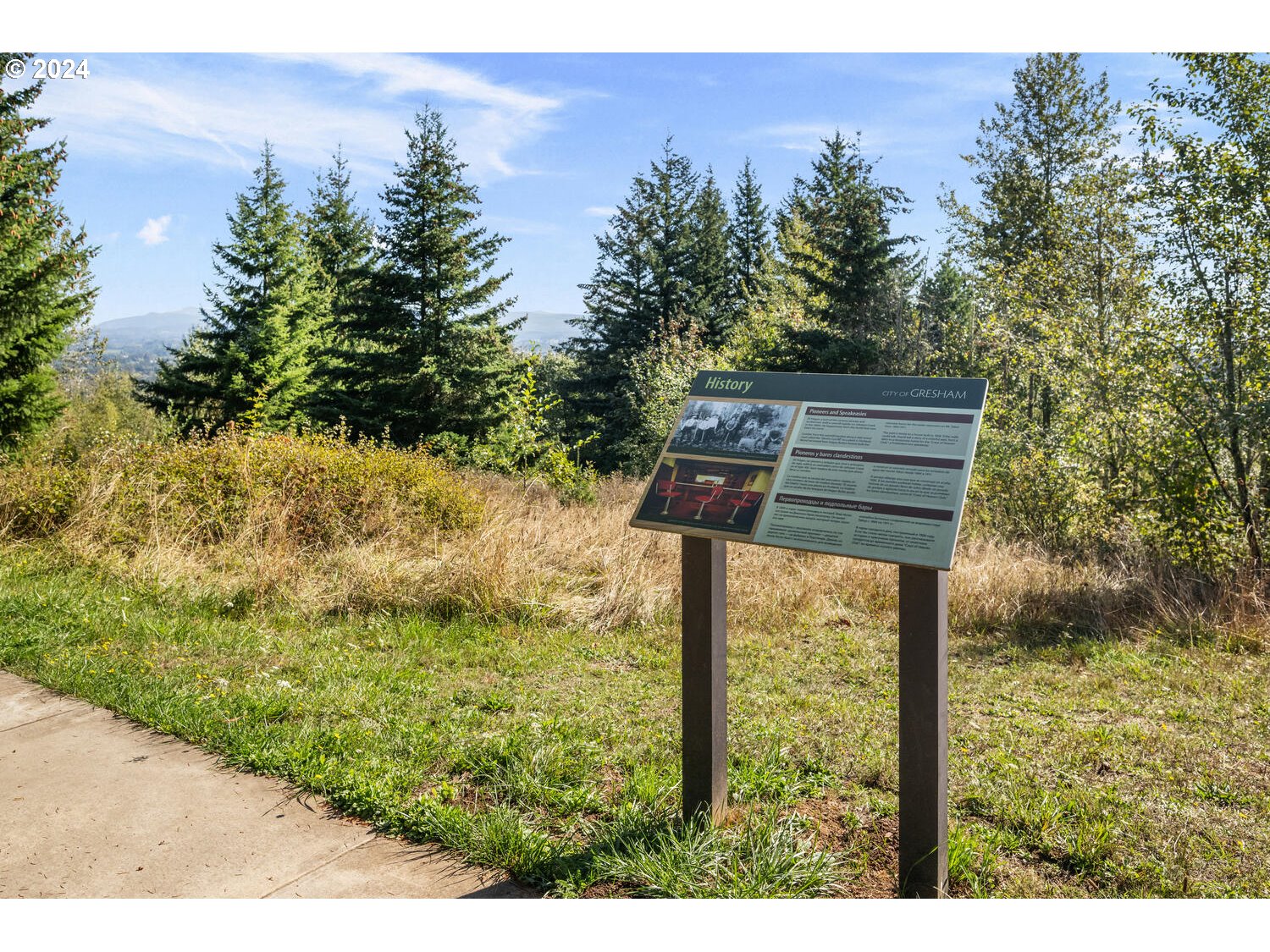 4083 Southeast Augusta Loop Gresham, OR 97080 - Photo 45 of 48 a backyard of a house with large trees